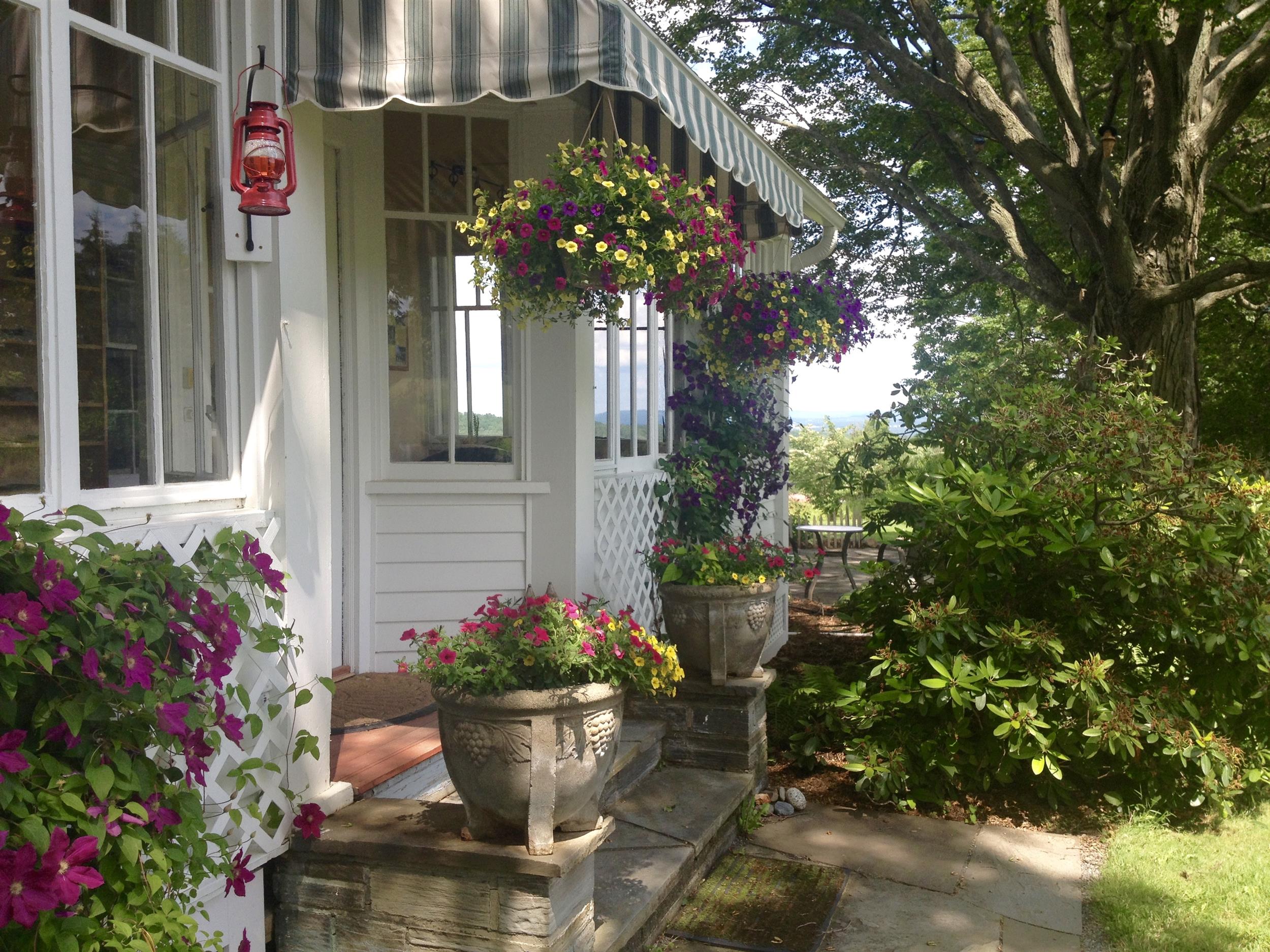 flowers and awning at front porch